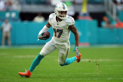 Dec 17, 2023; Miami Gardens, Florida, USA; Miami Dolphins wide receiver Jaylen Waddle (17) runs with the ball against the New York Jets during the second half at Hard Rock Stadium. Mandatory Credit: Jasen Vinlove-USA TODAY Sports