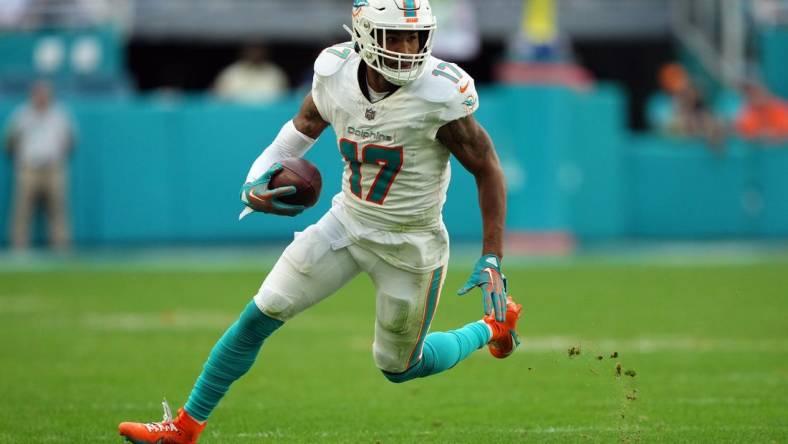 Dec 17, 2023; Miami Gardens, Florida, USA; Miami Dolphins wide receiver Jaylen Waddle (17) runs with the ball against the New York Jets during the second half at Hard Rock Stadium. Mandatory Credit: Jasen Vinlove-USA TODAY Sports