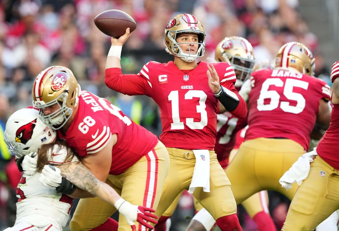 Dec 17, 2023; Glendale, Arizona, USA; San Francisco 49ers quarterback Brock Purdy (13) throws against the Arizona Cardinals during the first half at State Farm Stadium. Mandatory Credit: Joe Camporeale-USA TODAY Sports