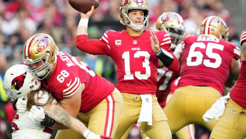 Dec 17, 2023; Glendale, Arizona, USA; San Francisco 49ers quarterback Brock Purdy (13) throws against the Arizona Cardinals during the first half at State Farm Stadium. Mandatory Credit: Joe Camporeale-USA TODAY Sports