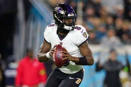 Dec 17, 2023; Jacksonville, Florida, USA;  Baltimore Ravens quarterback Lamar Jackson (8) drops back to pass against the Jacksonville Jaguars in the first quarter at EverBank Stadium. Mandatory Credit: Nathan Ray Seebeck-USA TODAY Sports