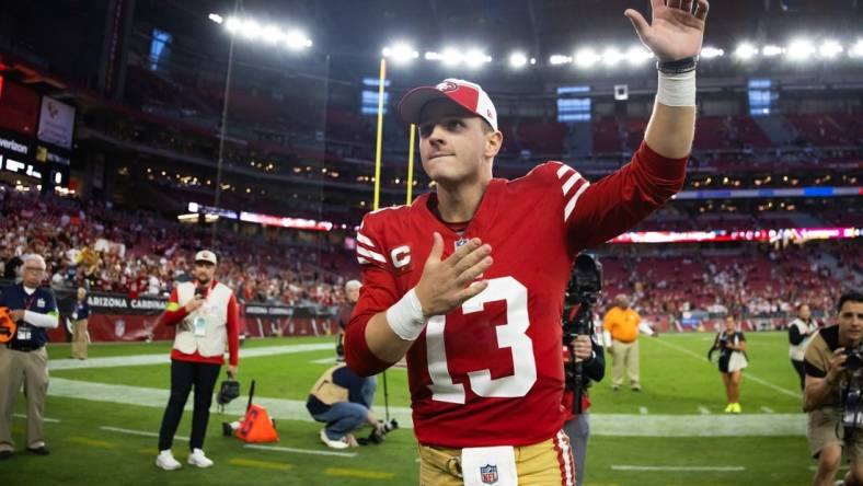 Dec 17, 2023; Glendale, Arizona, USA; San Francisco 49ers quarterback Brock Purdy (13) celebrates following the game against the Arizona Cardinals at State Farm Stadium. Mandatory Credit: Mark J. Rebilas-USA TODAY Sports