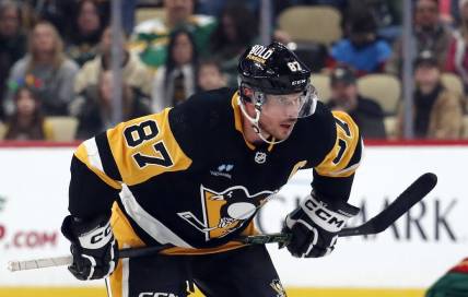 Dec 18, 2023; Pittsburgh, Pennsylvania, USA;  Pittsburgh Penguins center Sidney Crosby (87) prepares to take a face-off against the Minnesota Wild during the third period at PPG Paints Arena. Pittsburgh won 4-3. Mandatory Credit: Charles LeClaire-USA TODAY Sports