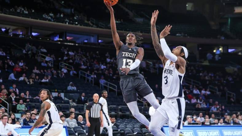 Dec 16, 2023; New York, New York, USA;  Georgia Tech Yellow Jackets guard Miles Kelly (13) and Penn State Nittany Lions guard Nick Kern Jr. (3) at Madison Square Garden. Mandatory Credit: Wendell Cruz-USA TODAY Sports