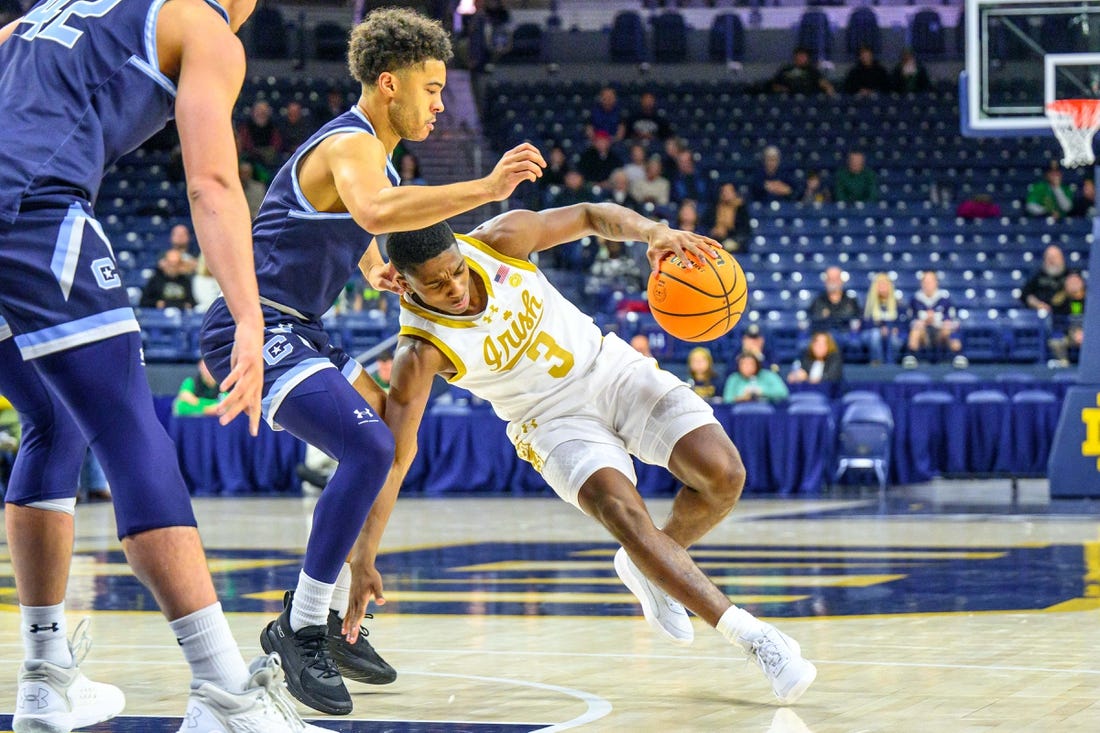 Dec 19, 2023; South Bend, Indiana, USA; Notre Dame Fighting Irish guard Markus Burton (3) loses his footing as Citadel Bulldogs guard Elijah Morgan (4) defends in the first half at the Purcell Pavilion. Mandatory Credit: Matt Cashore-USA TODAY Sports