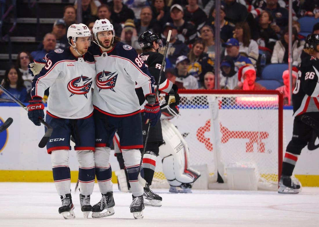 Dec 19, 2023; Buffalo, New York, USA;  Columbus Blue Jackets right wing Kirill Marchenko (86) celebrates his goal with teammates during the second period against the Buffalo Sabres at KeyBank Center. Mandatory Credit: Timothy T. Ludwig-USA TODAY Sports