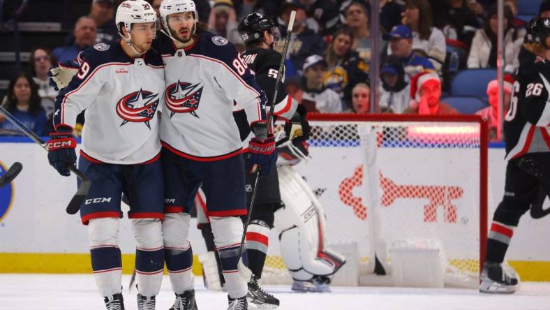 Dec 19, 2023; Buffalo, New York, USA;  Columbus Blue Jackets right wing Kirill Marchenko (86) celebrates his goal with teammates during the second period against the Buffalo Sabres at KeyBank Center. Mandatory Credit: Timothy T. Ludwig-USA TODAY Sports