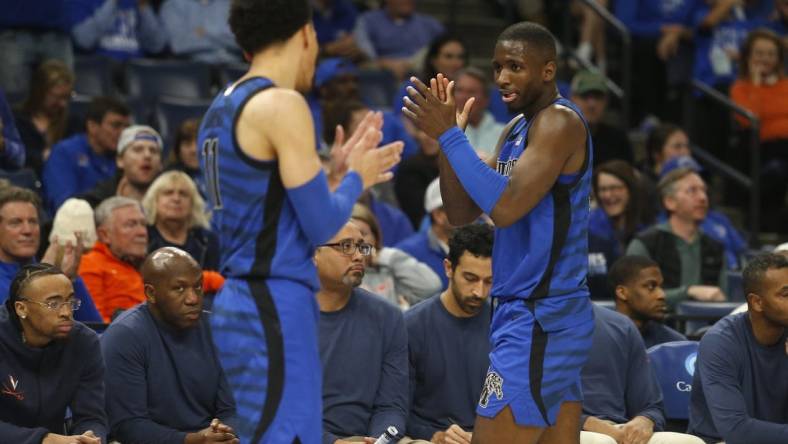 Dec 19, 2023; Memphis, Tennessee, USA; Memphis Tigers guard Jahvon Quinerly (11) and forward David Jones (8) react during the second half against the Virginia Cavaliers at FedExForum. Mandatory Credit: Petre Thomas-USA TODAY Sports