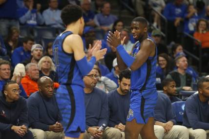 Dec 19, 2023; Memphis, Tennessee, USA; Memphis Tigers guard Jahvon Quinerly (11) and forward David Jones (8) react during the second half against the Virginia Cavaliers at FedExForum. Mandatory Credit: Petre Thomas-USA TODAY Sports