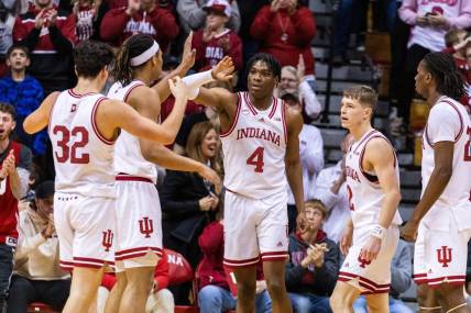 Dec 19, 2023; Bloomington, Indiana, USA; Indiana Hoosiers forward Anthony Walker (4) celebrates a basket and foul with teammates in the second half against the Morehead State Eagles at Simon Skjodt Assembly Hall. Mandatory Credit: Trevor Ruszkowski-USA TODAY Sports