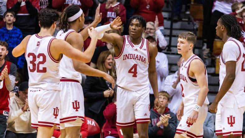 Dec 19, 2023; Bloomington, Indiana, USA; Indiana Hoosiers forward Anthony Walker (4) celebrates a basket and foul with teammates in the second half against the Morehead State Eagles at Simon Skjodt Assembly Hall. Mandatory Credit: Trevor Ruszkowski-USA TODAY Sports