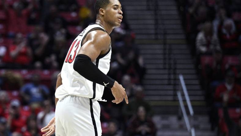 Dec 19, 2023; San Diego, California, USA; San Diego State Aztecs forward Jaedon LeDee (13) reacts after a three-point basket against the Saint Katherine Firebirds during the first half at Viejas Arena. Mandatory Credit: Orlando Ramirez-USA TODAY Sports