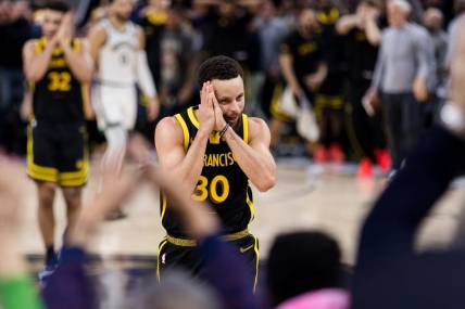 Dec 19, 2023; San Francisco, California, USA; Golden State Warriors guard Stephen Curry (30) reacts after scoring against the Boston Celtics during the overtime period at Chase Center. Mandatory Credit: John Hefti-USA TODAY Sports