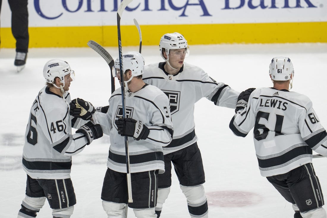 Dec 19, 2023; San Jose, California, USA; Los Angeles Kings center Trevor Lewis (61), center Blake Lizotte (46), defenseman Jacob Moverare (43) and defenseman Matt Roy (3) celebrate after a goal during the third period against the San Jose Sharks at SAP Center at San Jose. Mandatory Credit: Neville E. Guard-USA TODAY Sports