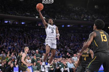 Dec 20, 2023; New York, New York, USA; Duke Blue Devils guard Jeremy Roach (3) drives to the basket as Baylor Bears guard Langston Love (13) looks on during the first half at Madison Square Garden. Mandatory Credit: John Jones-USA TODAY Sports
