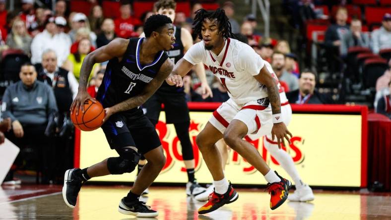 Dec 20, 2023; Raleigh, North Carolina, USA; Saint Louis Billikens guard Cian Medley (1) dribbles with the ball during the first half against North Carolina State Wolfpack at PNC Arena. Mandatory Credit: Jaylynn Nash-USA TODAY Sports