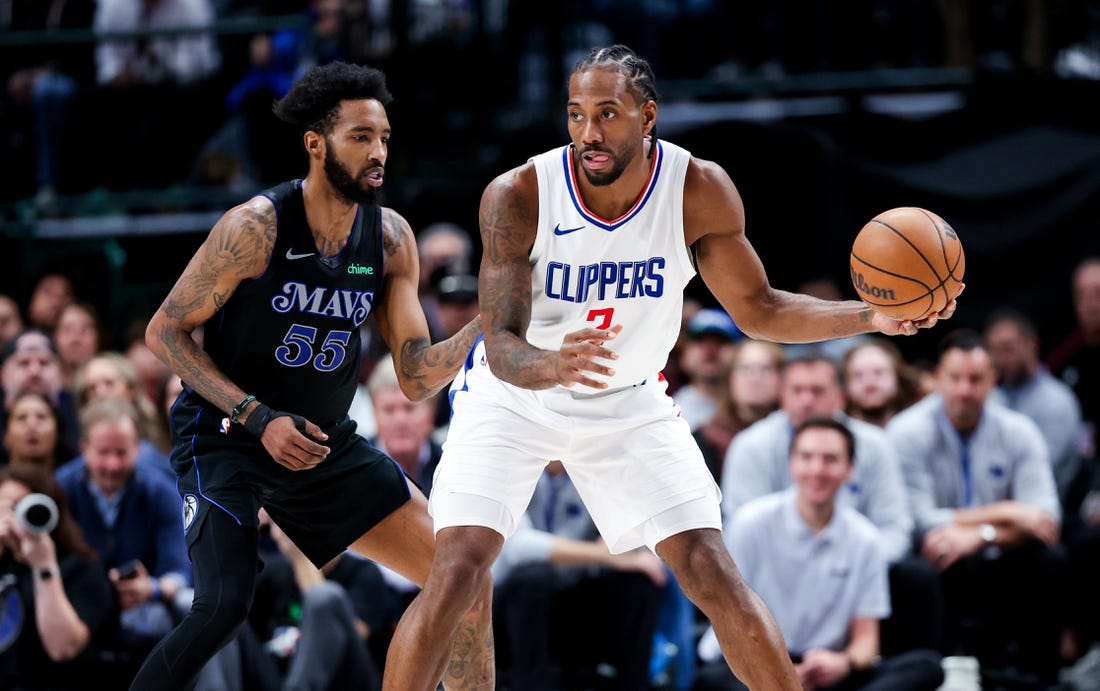 Dec 20, 2023; Dallas, Texas, USA;  LA Clippers forward Kawhi Leonard (2) controls the ball as Dallas Mavericks forward Derrick Jones Jr. (55) defends during the second quarter at American Airlines Center. Mandatory Credit: Kevin Jairaj-USA TODAY Sports