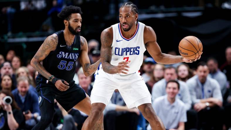 Dec 20, 2023; Dallas, Texas, USA;  LA Clippers forward Kawhi Leonard (2) controls the ball as Dallas Mavericks forward Derrick Jones Jr. (55) defends during the second quarter at American Airlines Center. Mandatory Credit: Kevin Jairaj-USA TODAY Sports