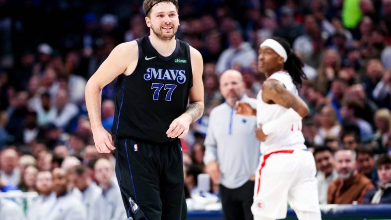 Dec 20, 2023; Dallas, Texas, USA;  Dallas Mavericks guard Luka Doncic (77) reacts after scoring during the second quarter against the LA Clippers at American Airlines Center. Mandatory Credit: Kevin Jairaj-USA TODAY Sports