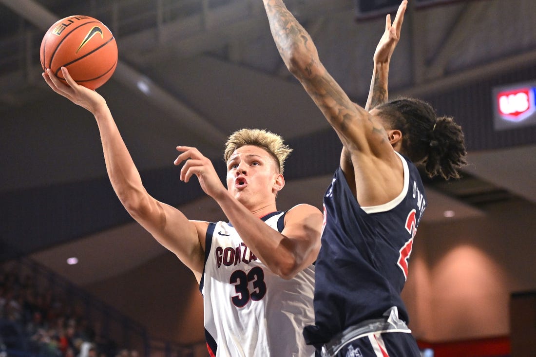 Dec 20, 2023; Spokane, Washington, USA; Gonzaga Bulldogs forward Ben Gregg (33) shoots the ball against Jackson State Tigers forward Jordan O'Neal (23) in the first half at McCarthey Athletic Center. Mandatory Credit: James Snook-USA TODAY Sports