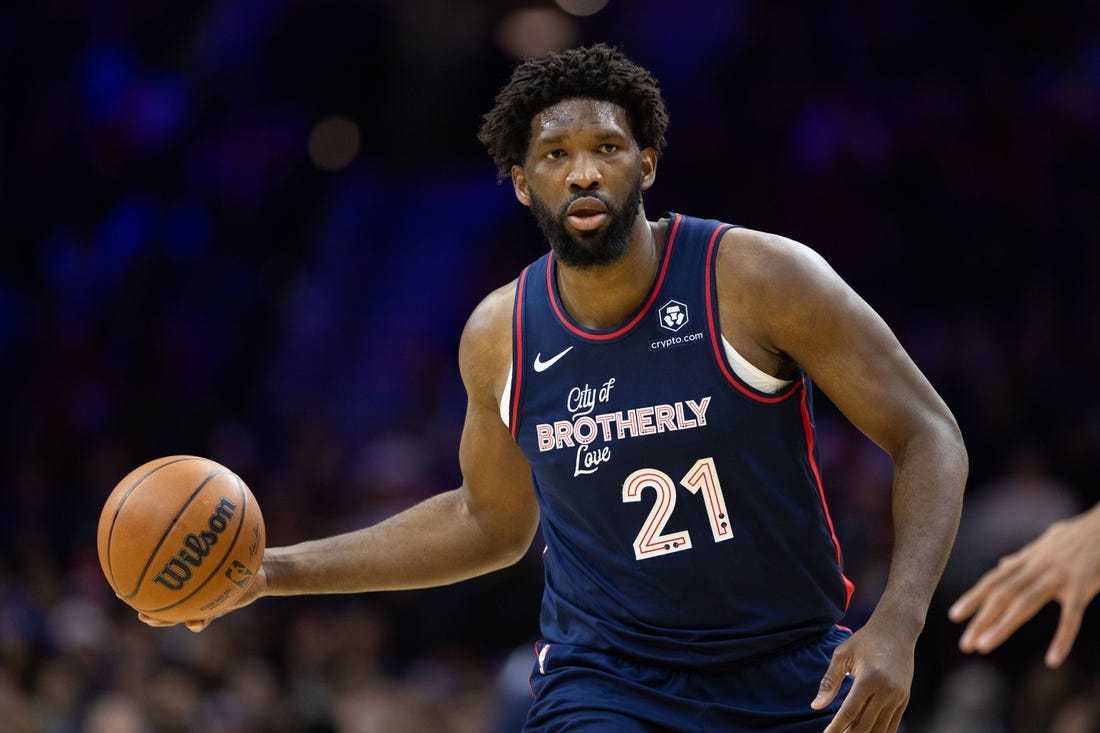 Dec 20, 2023; Philadelphia, Pennsylvania, USA; Philadelphia 76ers center Joel Embiid (21) dribbles up court against the Minnesota Timberwolves during the third quarter at Wells Fargo Center. Mandatory Credit: Bill Streicher-USA TODAY Sports