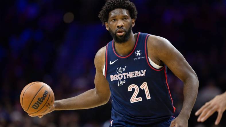 Dec 20, 2023; Philadelphia, Pennsylvania, USA; Philadelphia 76ers center Joel Embiid (21) dribbles up court against the Minnesota Timberwolves during the third quarter at Wells Fargo Center. Mandatory Credit: Bill Streicher-USA TODAY Sports