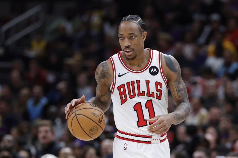 Dec 20, 2023; Chicago, Illinois, USA; Chicago Bulls forward DeMar DeRozan (11) brings the ball up court against the Los Angeles Lakers during the first half at United Center. Mandatory Credit: Kamil Krzaczynski-USA TODAY Sports