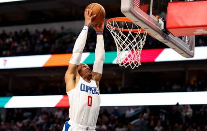 Dec 20, 2023; Dallas, Texas, USA;  LA Clippers guard Russell Westbrook (0) dunks the ball during the second half against the Dallas Mavericks at American Airlines Center. Mandatory Credit: Kevin Jairaj-USA TODAY Sports