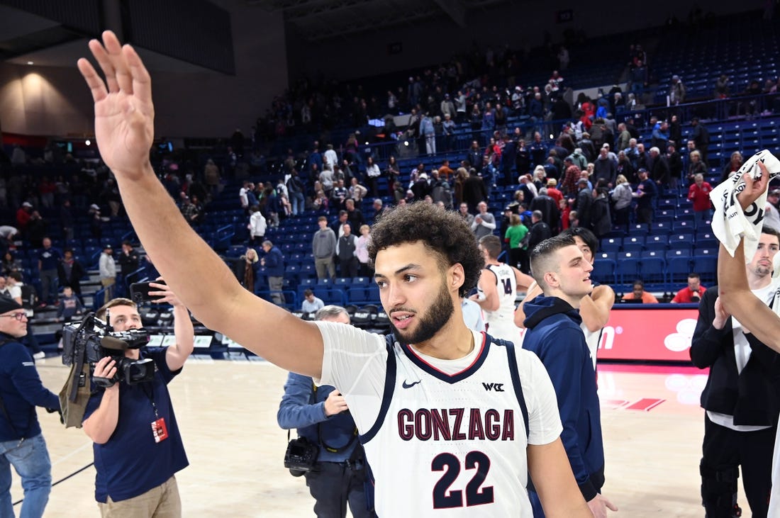 Dec 20, 2023; Spokane, Washington, USA; Gonzaga Bulldogs forward Anton Watson (22) waves to the crowd after a game against the Jackson State Tigers at McCarthey Athletic Center. Gonzaga won 100-76. Mandatory Credit: James Snook-USA TODAY Sports