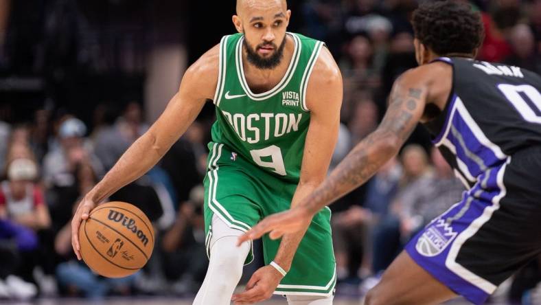 Dec 20, 2023; Sacramento, California, USA; Boston Celtics guard Derrick White (9) controls the ball against Sacramento Kings guard Malik Monk (0) during the fourth quarter at Golden 1 Center. Mandatory Credit: Ed Szczepanski-USA TODAY Sports