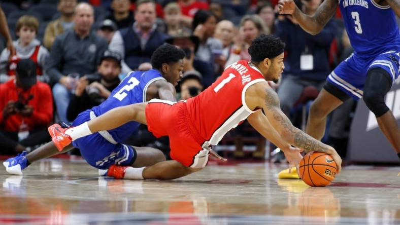 Dec 21, 2023; Columbus, Ohio, USA; Ohio State Buckeyes guard Roddy Gayle Jr. (1) dives for the ball as New Orleans Privateers guard Jah Short (2) defends during the first half at Value City Arena. Mandatory Credit: Joseph Maiorana-USA TODAY Sports