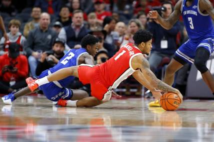 Dec 21, 2023; Columbus, Ohio, USA; Ohio State Buckeyes guard Roddy Gayle Jr. (1) dives for the ball as New Orleans Privateers guard Jah Short (2) defends during the first half at Value City Arena. Mandatory Credit: Joseph Maiorana-USA TODAY Sports