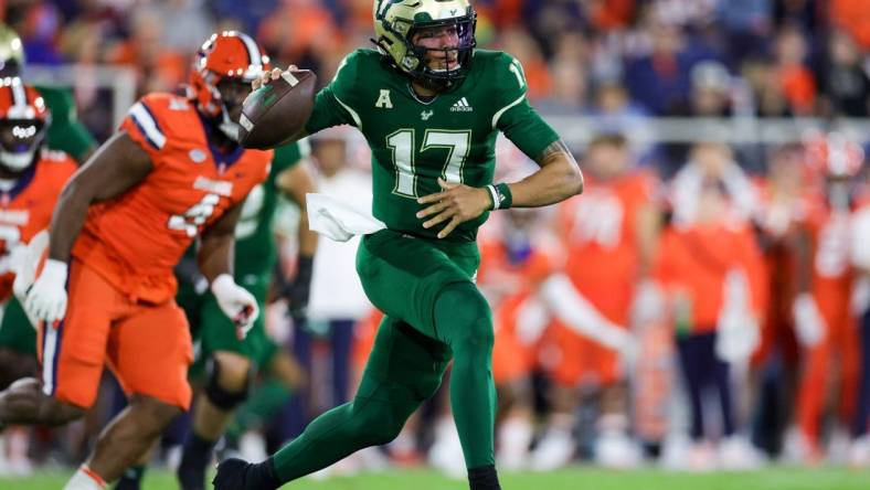 Dec 21, 2023; Boca Raton, FL, USA; South Florida Bulls quarterback Byrum Brown (17) drops back to pass against the Syracuse Orange in the first quarter during the RoofClaim.com Boca Raton Bowl at FAU Stadium. Mandatory Credit: Nathan Ray Seebeck-USA TODAY Sports