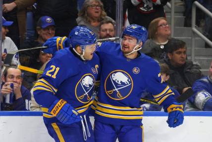 Dec 21, 2023; Buffalo, New York, USA;  Buffalo Sabres right wing Kyle Okposo (21) celebrates his shorthanded goal with defenseman Connor Clifton (75) during the second period against the Toronto Maple Leafs at KeyBank Center. Mandatory Credit: Timothy T. Ludwig-USA TODAY Sports