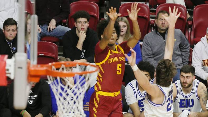 Iowa State Cyclones guard Curtis Jones (5) takes a three-point shot over Eastern Illinois Panthers guard Dan Luers (25) during the first half of a NCAA college basketball at Hilton Coliseum on Thursday, Dec. 21, 2023, in Ames, Iowa.