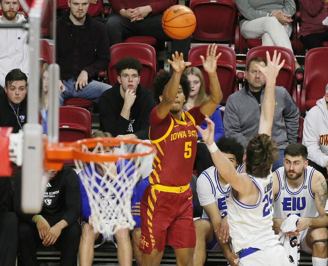 Iowa State Cyclones guard Curtis Jones (5) takes a three-point shot over Eastern Illinois Panthers guard Dan Luers (25) during the first half of a NCAA college basketball at Hilton Coliseum on Thursday, Dec. 21, 2023, in Ames, Iowa.