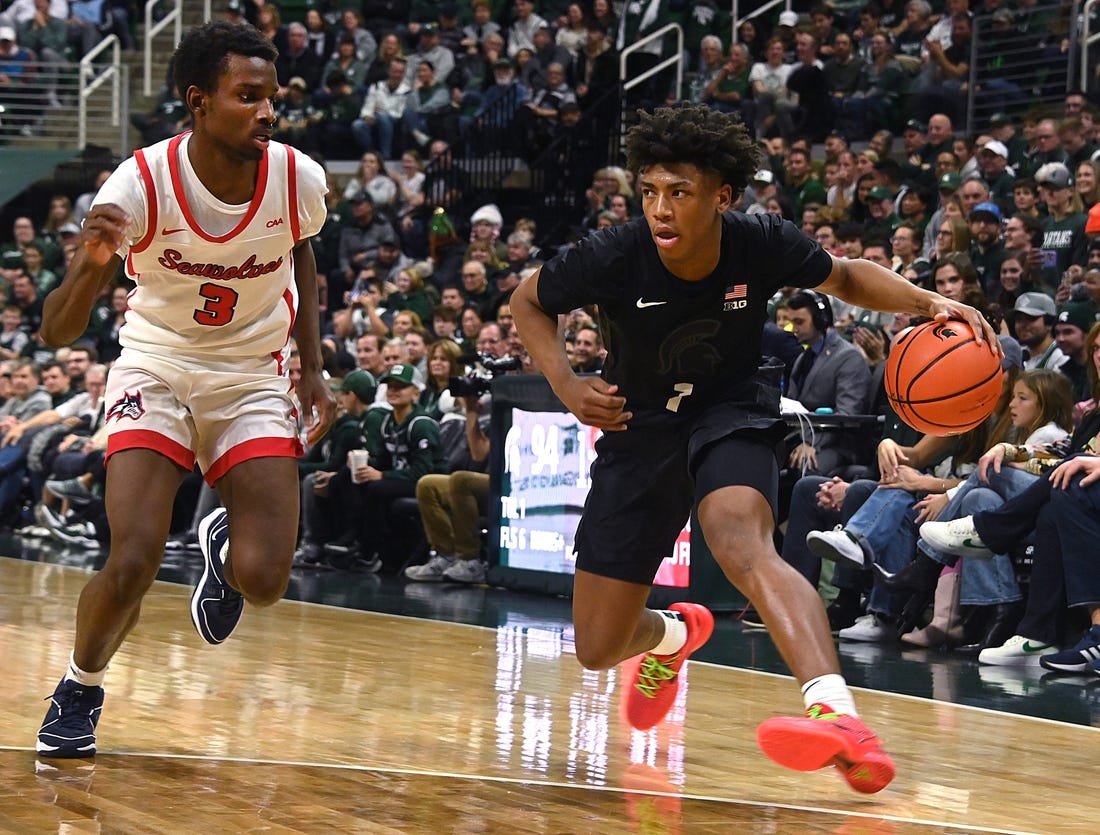 Dec 21, 2023; East Lansing, Michigan, USA; Michigan State Spartans guard Jeremy Fears Jr. (1) drives past Stony Brook Seawolves guard Toby Onyekonwu (3) during the second half at Jack Breslin Student Events Center. Mandatory Credit: Dale Young-USA TODAY Sports