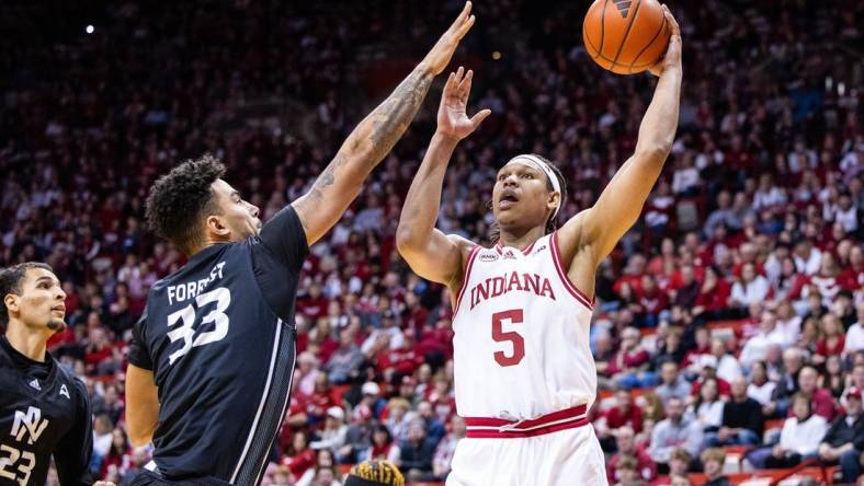 Dec 21, 2023; Bloomington, Indiana, USA; Indiana Hoosiers forward Malik Reneau (5) shoots the ball while North Alabama Lions forward Damian Forrest (33) defends in the first half at Simon Skjodt Assembly Hall. Mandatory Credit: Trevor Ruszkowski-USA TODAY Sports