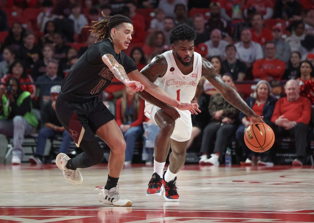 Dec 21, 2023; Houston, Texas, USA; Houston Cougars guard Jamal Shead (1) dribbles against Texas State Bobcats guard Kaden Gumbs (11) in the second half at Fertitta Center. Mandatory Credit: Thomas Shea-USA TODAY Sports