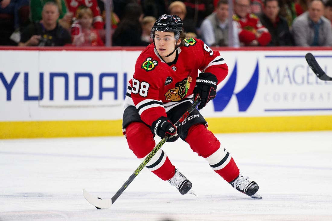 Dec 19, 2023; Chicago, Illinois, USA;  Chicago Blackhawks forward Connor Bedard (98) skates against the Colorado Avalanche at United Center. Mandatory Credit: Jamie Sabau-USA TODAY Sports