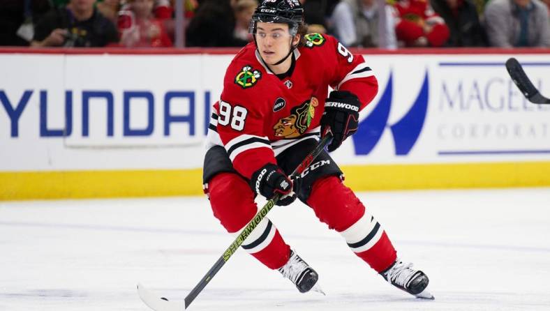 Dec 19, 2023; Chicago, Illinois, USA;  Chicago Blackhawks forward Connor Bedard (98) skates against the Colorado Avalanche at United Center. Mandatory Credit: Jamie Sabau-USA TODAY Sports