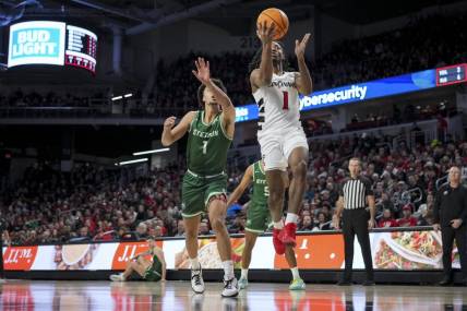 Dec 22, 2023; Cincinnati, Ohio, USA;  Cincinnati Bearcats forward Day Day Thomas (1) drives to the basket against Stetson Hatters guard Tristan Gross (1) in the first half at Fifth Third Arena. Mandatory Credit: Aaron Doster-USA TODAY Sports