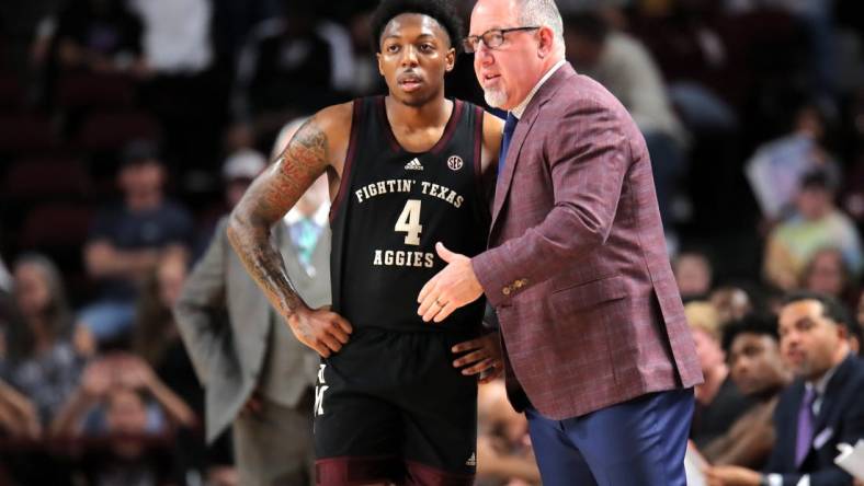 Dec 22, 2023; College Station, Texas, USA; Texas A&M Aggies head coach Buzz Williams (right) talks with Texas A&M Aggies guard Wade Taylor IV (4) against the Houston Christian Huskies during the first half at Reed Arena. Mandatory Credit: Erik Williams-USA TODAY Sports