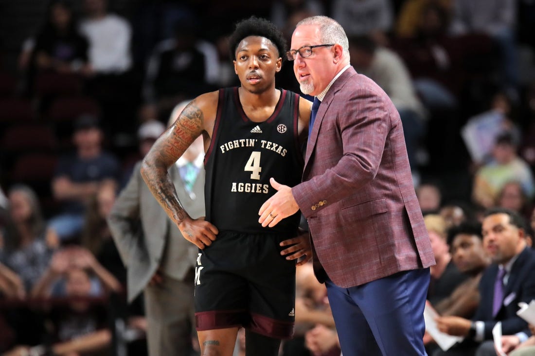 Dec 22, 2023; College Station, Texas, USA; Texas A&M Aggies head coach Buzz Williams (right) talks with Texas A&M Aggies guard Wade Taylor IV (4) against the Houston Christian Huskies during the first half at Reed Arena. Mandatory Credit: Erik Williams-USA TODAY Sports