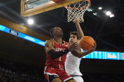 Dec 22, 2023; Los Angeles, California, USA; Maryland Terrapins guard Jahmir Young (1) shoots the ball against UCLA Bruins center Aday Mara (15) in the first half at Pauley Pavilion presented by Wescom. Mandatory Credit: Kirby Lee-USA TODAY Sports