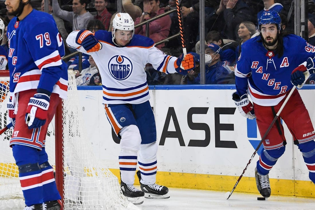 Dec 22, 2023; New York, New York, USA;  Edmonton Oilers left wing Zach Hyman (18) celebrates his goal against the New York Rangers during the third period at Madison Square Garden. Mandatory Credit: Dennis Schneidler-USA TODAY Sports