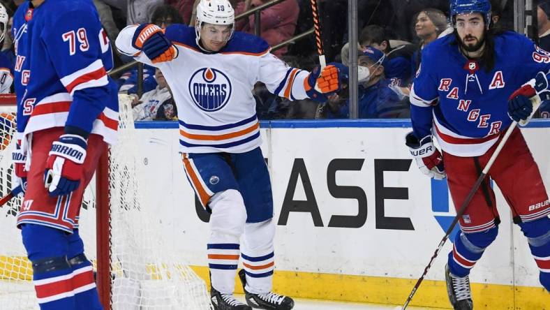 Dec 22, 2023; New York, New York, USA;  Edmonton Oilers left wing Zach Hyman (18) celebrates his goal against the New York Rangers during the third period at Madison Square Garden. Mandatory Credit: Dennis Schneidler-USA TODAY Sports