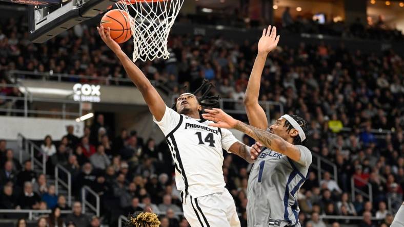 Dec 23, 2023; Providence, Rhode Island, USA; Providence Friars guard Corey Floyd Jr. (14) shoots the ball against the Butler Bulldogs during the first half at Amica Mutual Pavilion. Mandatory Credit: Eric Canha-USA TODAY Sports