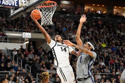 Dec 23, 2023; Providence, Rhode Island, USA; Providence Friars guard Corey Floyd Jr. (14) shoots the ball against the Butler Bulldogs during the first half at Amica Mutual Pavilion. Mandatory Credit: Eric Canha-USA TODAY Sports
