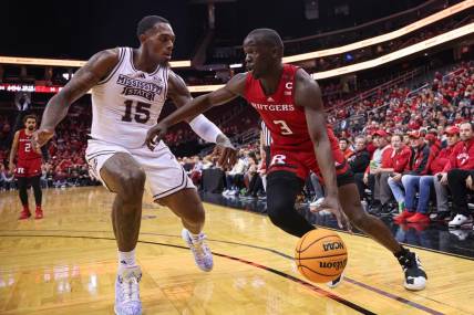 Dec 23, 2023; Newark, NY, USA; Rutgers Scarlet Knights forward Mawot Mag (3) dribbles against Mississippi State Bulldogs forward Jimmy Bell Jr. (15) during the first half at Prudential Center. Mandatory Credit: Vincent Carchietta-USA TODAY Sports